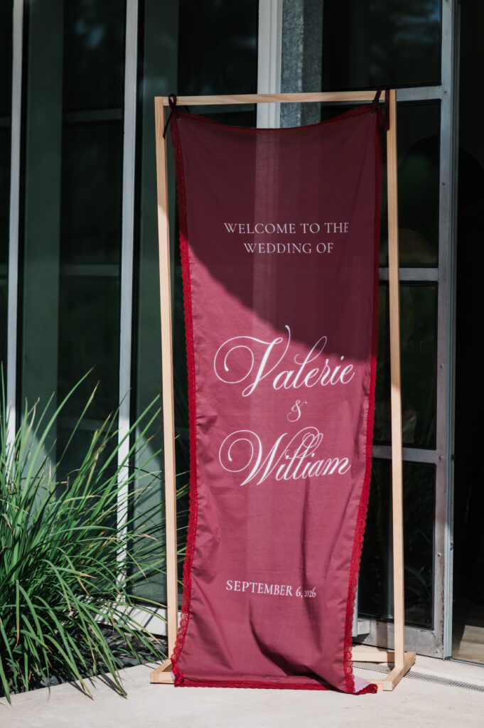Burgundy draped wedding ceremony arch at Prospect House, an Austin wedding venue