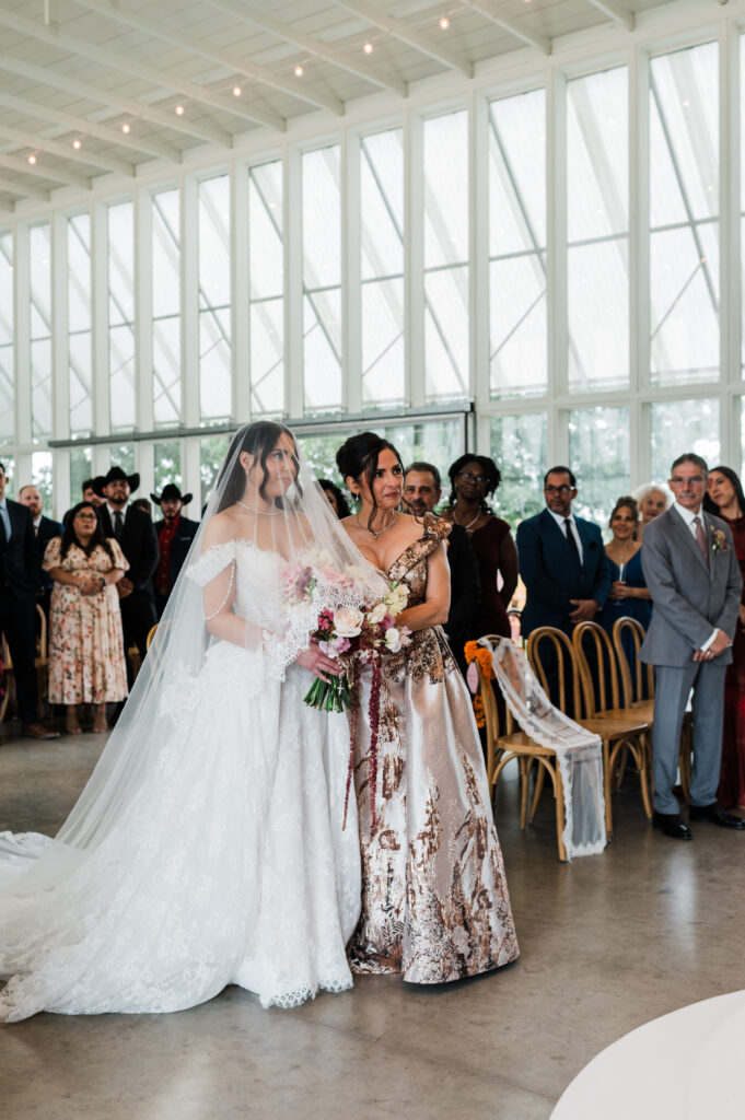 Burgundy draped wedding ceremony arch at Prospect House, an Austin wedding venue