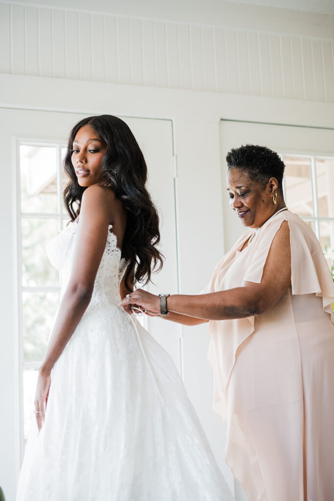 Quiana and David getting ready for their wedding at Jacob's Well Vineyard in Wimberley, TX