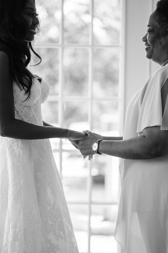 Quiana and David getting ready for their wedding at Jacob's Well Vineyard in Wimberley, TX