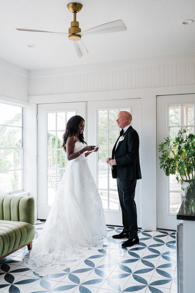 Quiana and David's first look and handwritten cards at Jacob's Well Vineyard in Wimberley, TX
