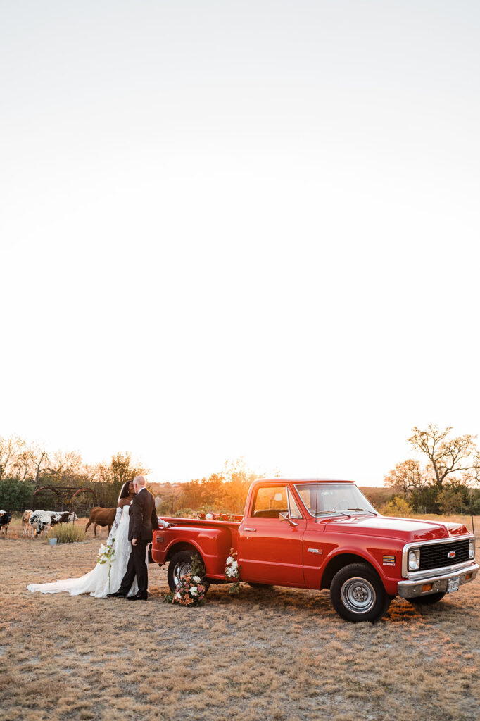 Quiana and David's golden hour portraits with a vintage red truck in Wimberley, TX