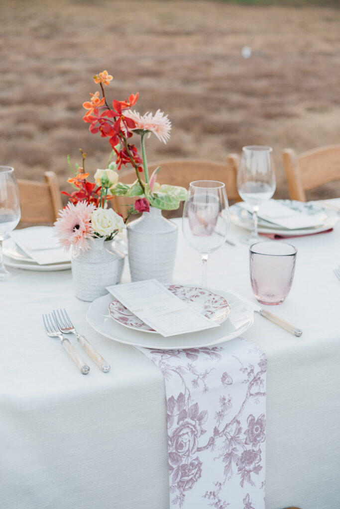 Candlelit long-table reception at Jacob's Well Vineyard in Wimberley, TX