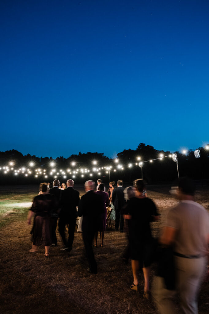Candlelit long-table reception at Jacob's Well Vineyard in Wimberley, TX