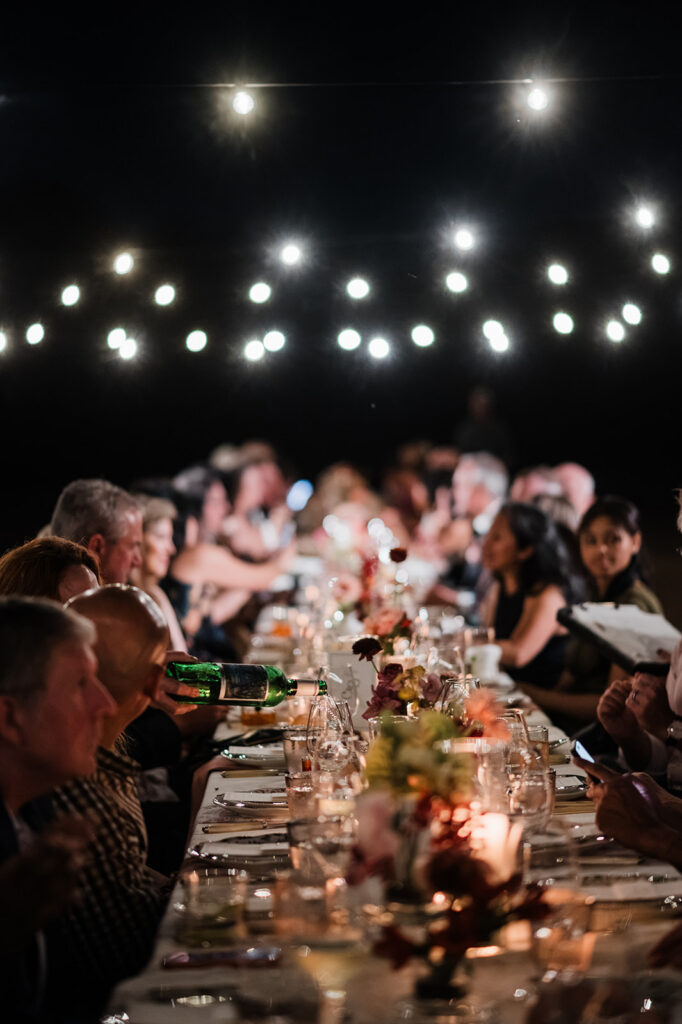 Candlelit long-table reception at Jacob's Well Vineyard in Wimberley, TX